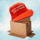 Photo illustration of MAGA hat on top of shipping boxes 